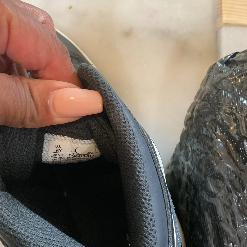 Jordan Kids Black and White High-Top Sneakers